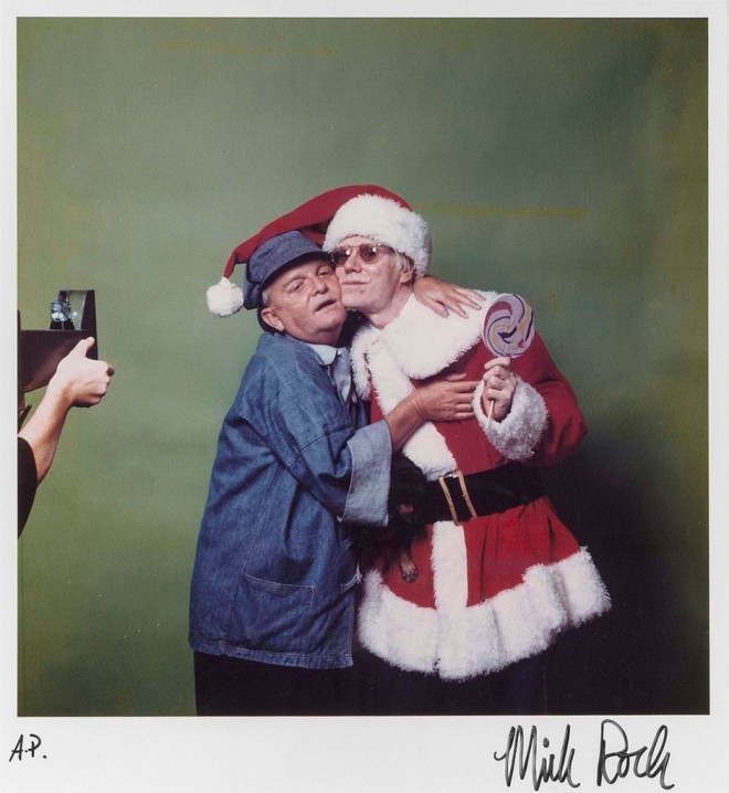 Mick Rock - Andy Warhol as Father Christmas, embracing Truman Capote